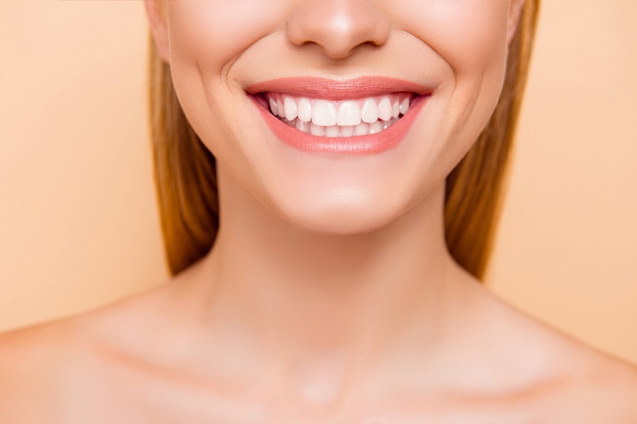 Restoring a Smile With Dental Crowns and Veneers